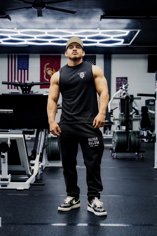 Origin Sweats in black, worn with a black tank